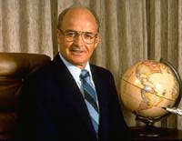 Al sitting at his desk